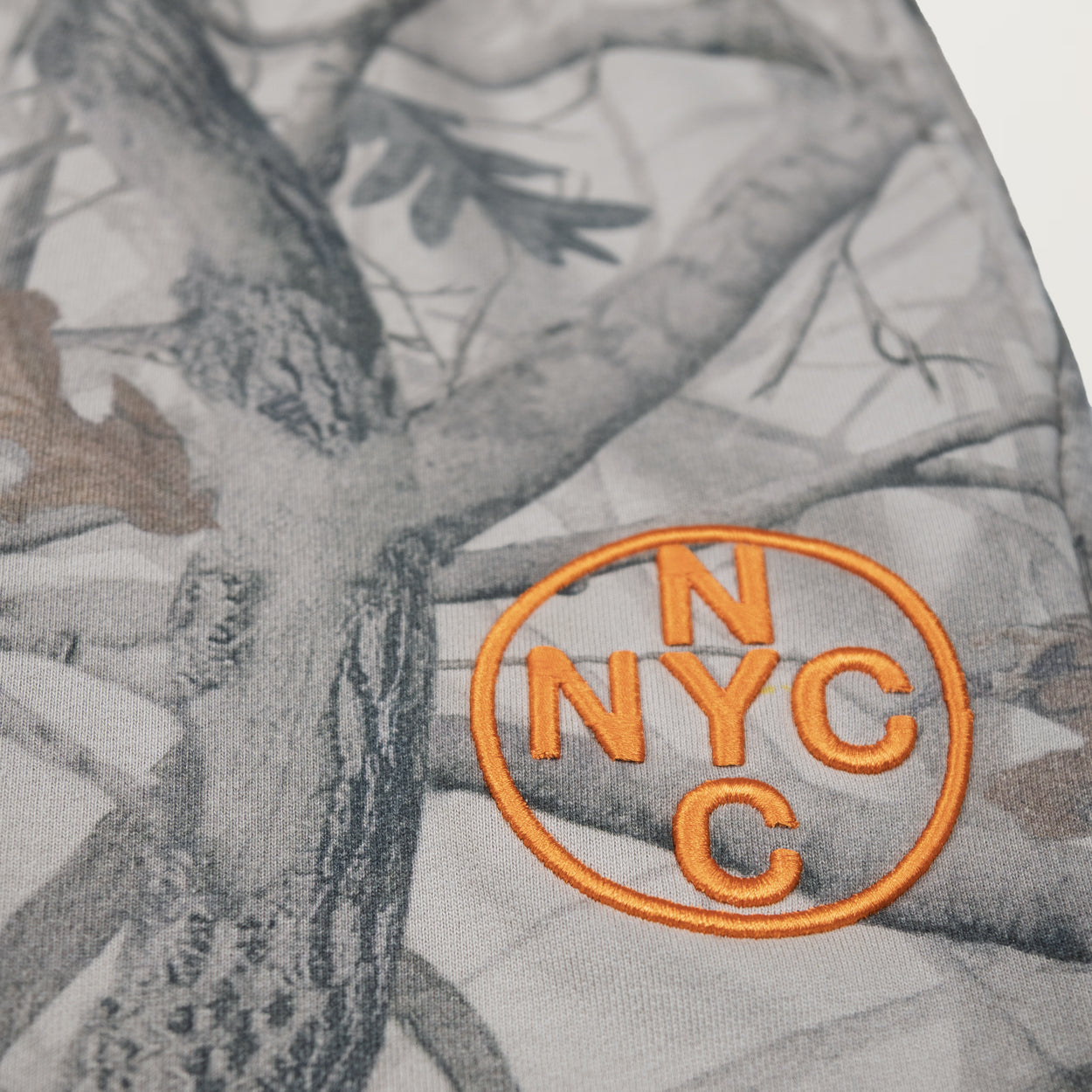 NewYakCity Top 10 Embroidered Flare Sweatpants (Camo)